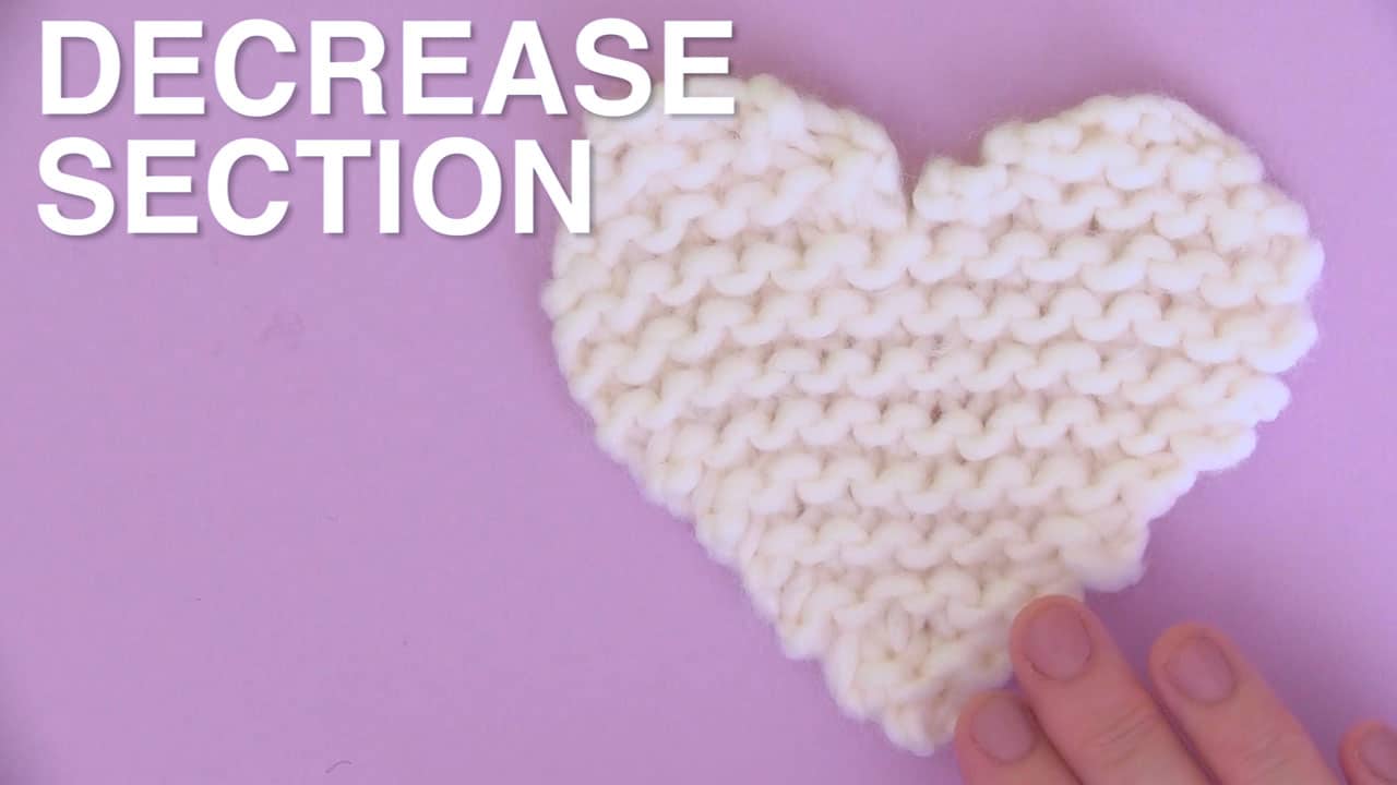 White knitted heart decrease section