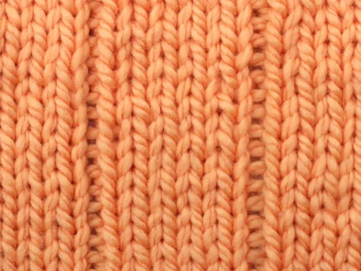 5x1 Flat Rib Stitch pattern in orange yarn color.