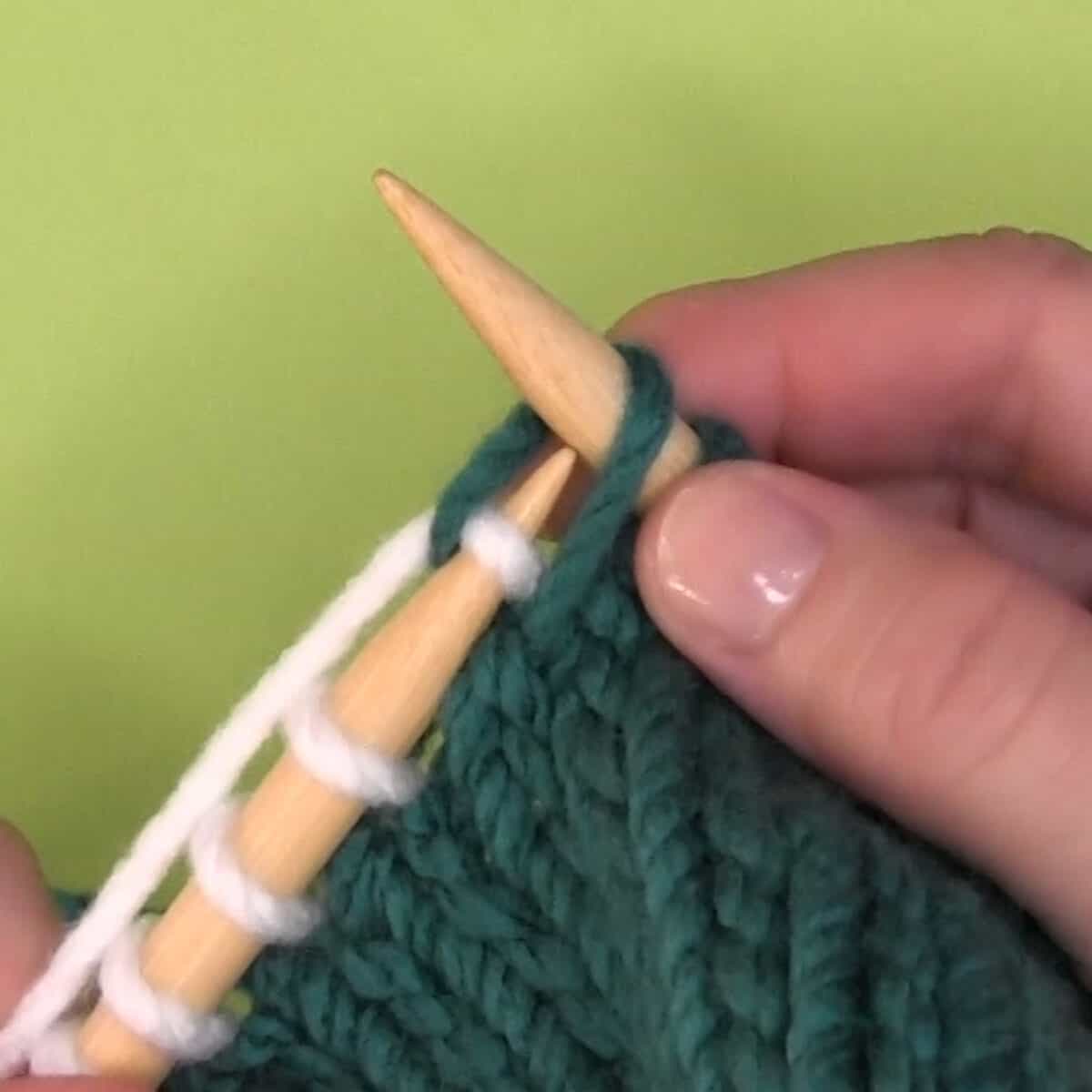 Left-handed demonstration of knitting through the back loop.