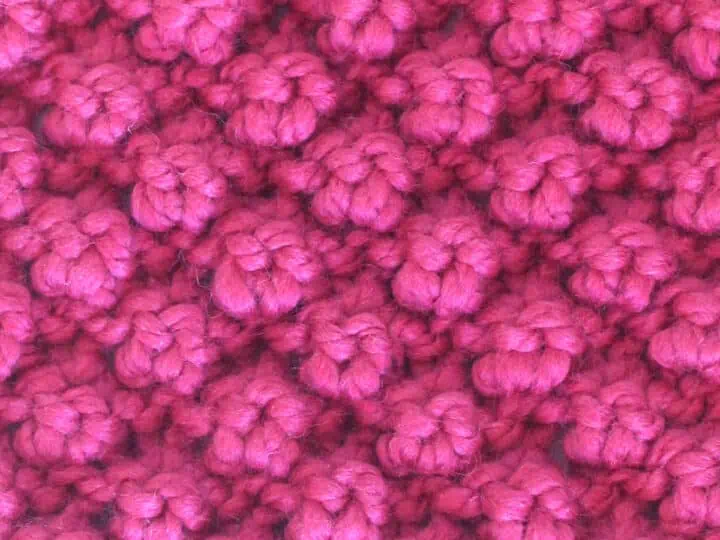 Raspberry Stitch knitted with pink color yarn.