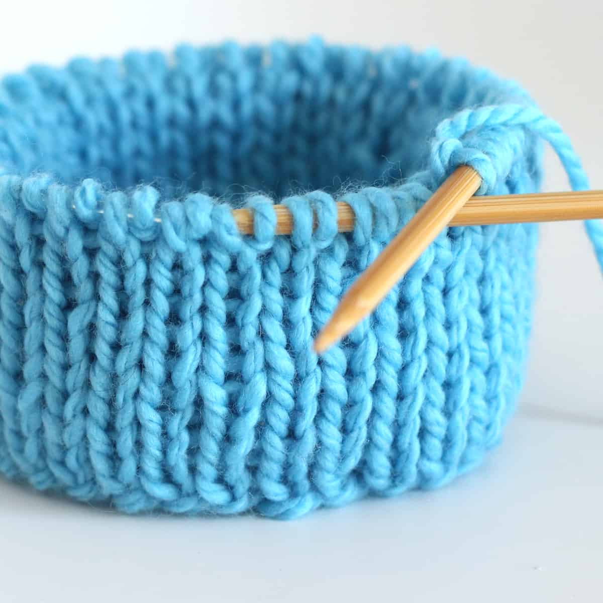 Double Stockinette stitch knitted in the round on circular needles in blue color yarn.