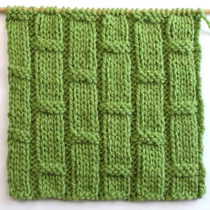 Bamboo Ribbing texture knitted in green colored yarn on bamboo needle.