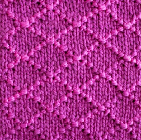 Diamond Stitch knitted in purple yarn color.