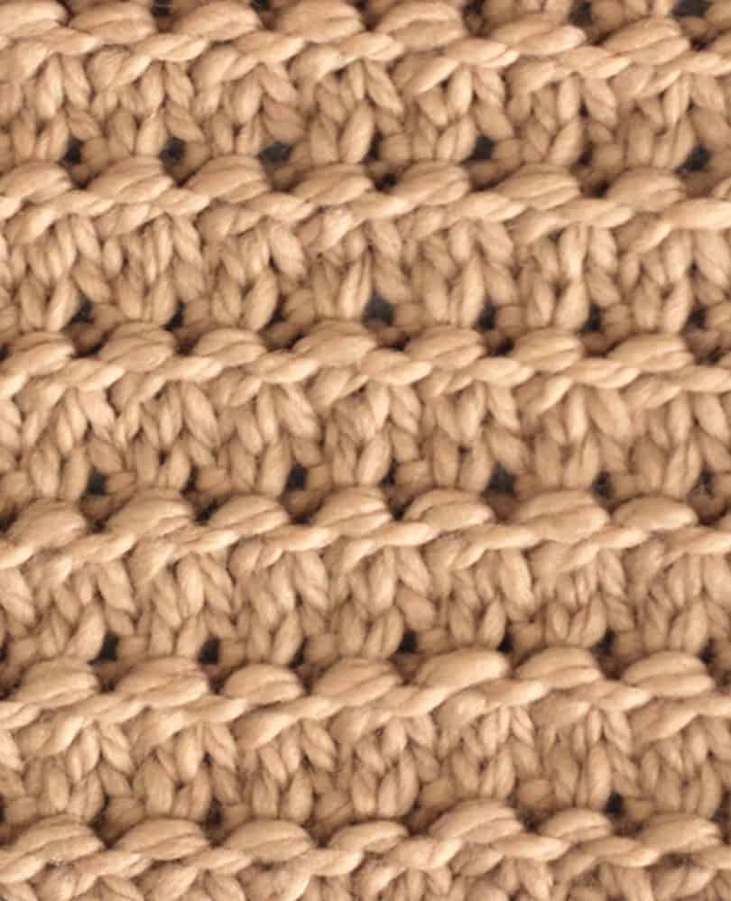 4 row repeat of Granite stitch knitted in light brown colored yarn.