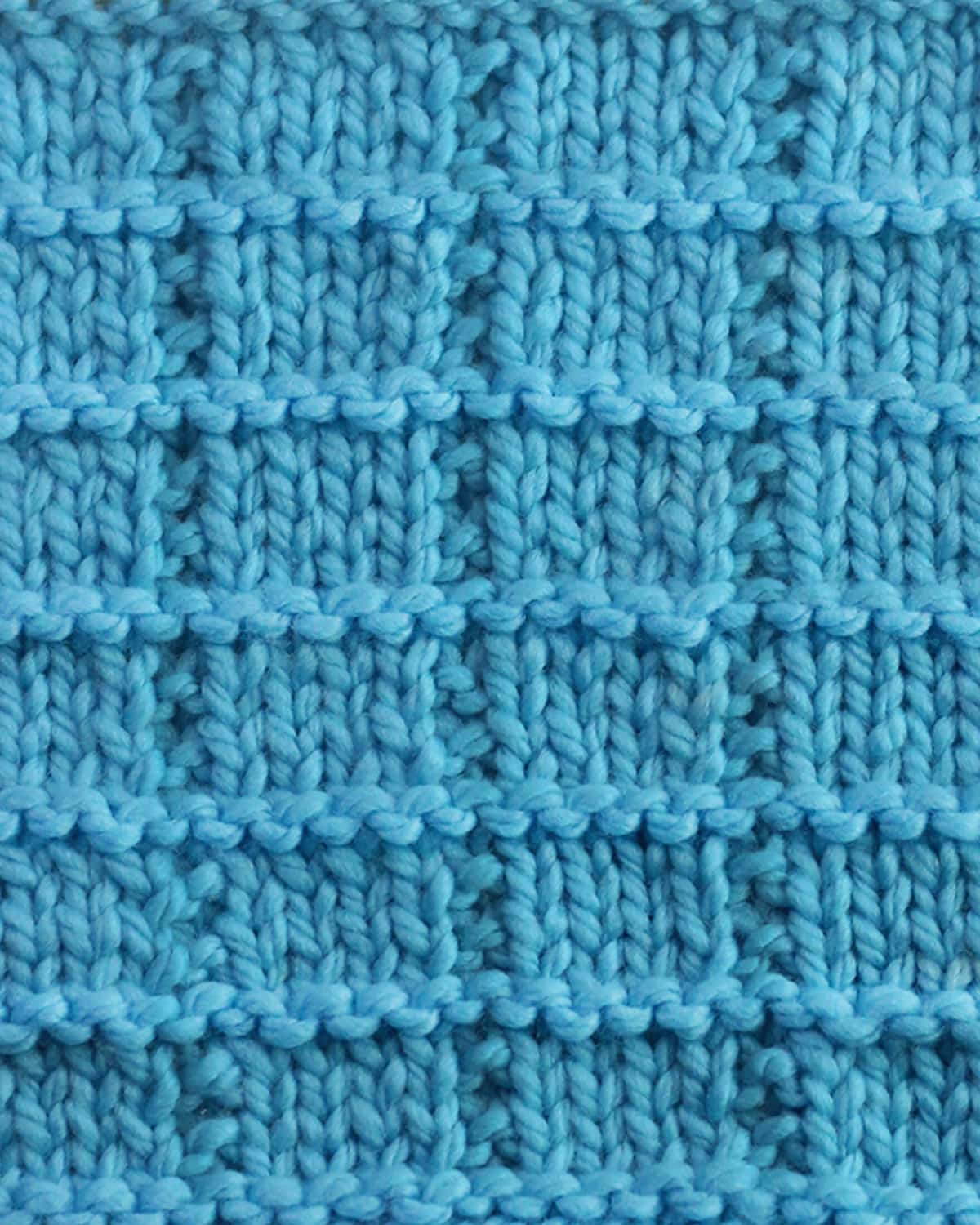 Tile Square stitch texture knitted with blue colored yarn.