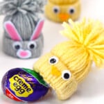 Yarn craft chicks and bunnies with a cadbury creme egg.