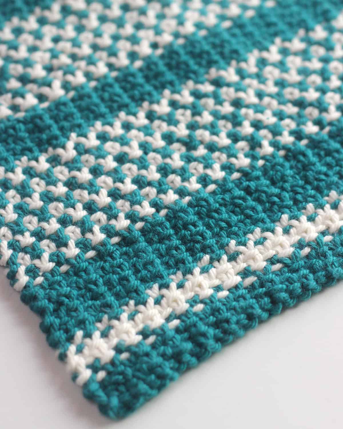 Texture design knitted with blue and white colored yarn.