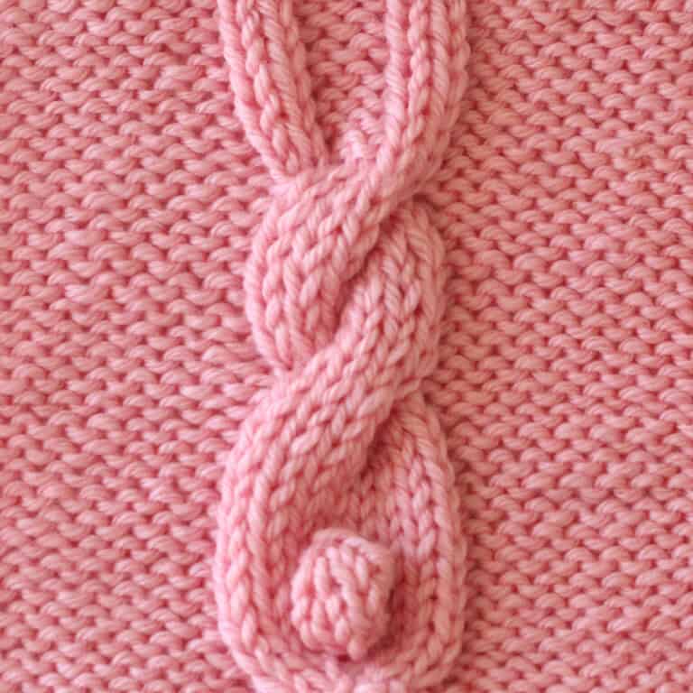 Bunny Cable knitting square in pink yarn color.